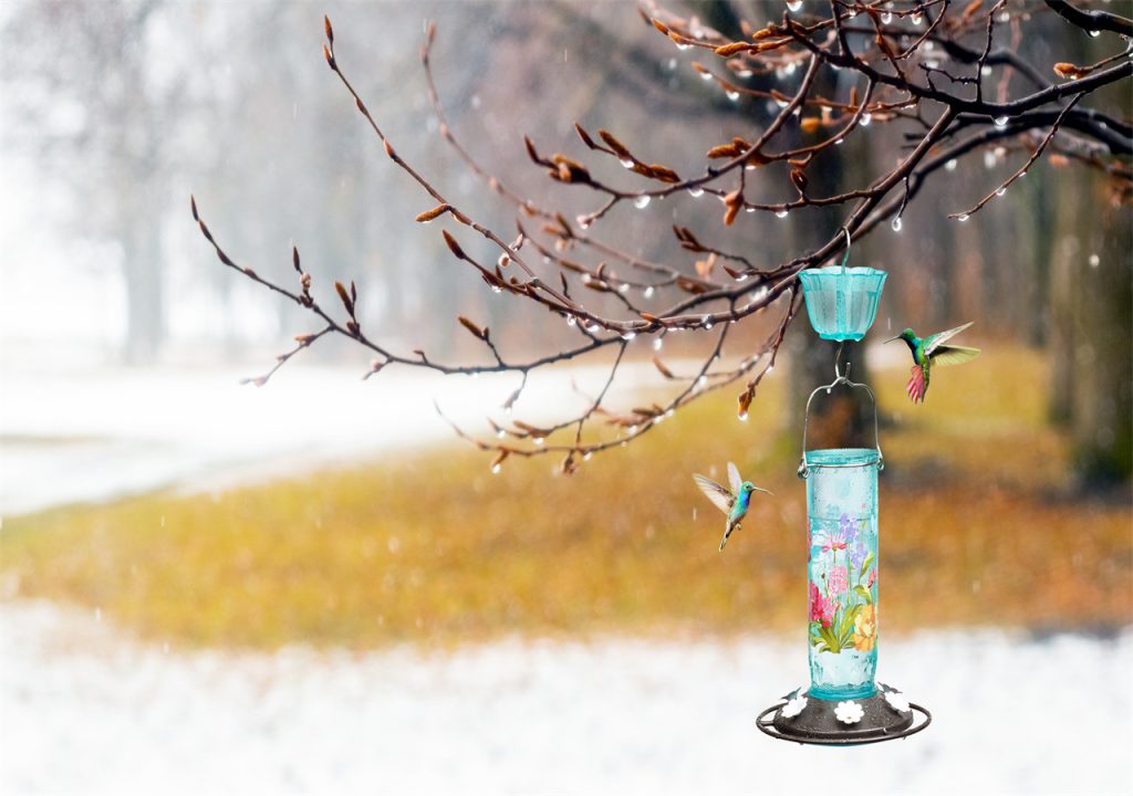 On a cold day, a bird feeder is hung in a tree to provide food for the little birds.